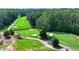 Picture of lush green golf course with manicured fairways, sand traps, and mature trees at 3467 Clubland Dr, Marietta, GA 30068