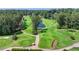 Scenic golf course view featuring lush green fairways, a serene pond, and mature trees at 3467 Clubland Dr, Marietta, GA 30068
