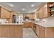 Spacious kitchen with island features light wood cabinets and stainless appliances at 3467 Clubland Dr, Marietta, GA 30068