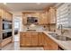 Modern kitchen features stainless double ovens, light wood cabinets, and updated countertops at 3467 Clubland Dr, Marietta, GA 30068