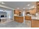 Bright kitchen with island, stainless appliances, and view into the living room with fireplace at 3467 Clubland Dr, Marietta, GA 30068
