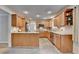 Open kitchen features light wood cabinets, island and view to living room at 3467 Clubland Dr, Marietta, GA 30068