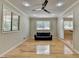Well-lit living room with hardwood floors, a ceiling fan, and large windows at 3467 Clubland Dr, Marietta, GA 30068