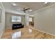 Bright living room featuring hardwood floors, modern lighting, and natural light at 3467 Clubland Dr, Marietta, GA 30068