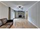 Bright and sunny living room features fireplace and hardwood floors at 3467 Clubland Dr, Marietta, GA 30068