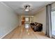 Spacious living area with hardwood floors and a comfortable leather sofa, leading to the kitchen at 3467 Clubland Dr, Marietta, GA 30068