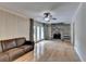 Bright living room features a stone fireplace, hardwood floors, and access to the outdoor area through glass doors at 3467 Clubland Dr, Marietta, GA 30068