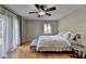 Main bedroom features a ceiling fan, hardwood floors, and lots of light at 3467 Clubland Dr, Marietta, GA 30068