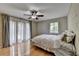 Main bedroom features a ceiling fan, hardwood floors, and lots of light at 3467 Clubland Dr, Marietta, GA 30068
