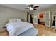 Main bedroom with hardwood floors, ceiling fan, and doorway leading to bath area at 3467 Clubland Dr, Marietta, GA 30068