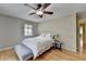Main bedroom features a ceiling fan, hardwood floors, and lots of light at 3467 Clubland Dr, Marietta, GA 30068