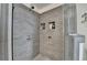 Shower featuring stone tile and inset storage at 3467 Clubland Dr, Marietta, GA 30068