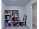 Simple storage room with wooden shelving to organize and store supplies, complete with overhead lighting at 3467 Clubland Dr, Marietta, GA 30068