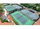 Aerial view of community tennis courts, perfect for an active lifestyle in a beautiful setting at 3467 Clubland Dr, Marietta, GA 30068