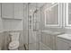 Sleek bathroom featuring a glass shower, dual lighted mirrors, and modern fixtures at 57 Forsyth Nw St # 14B, Atlanta, GA 30303