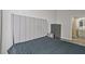 Modern bedroom with a large headboard, and a sliding door to the bathroom at 57 Forsyth Nw St # 14B, Atlanta, GA 30303