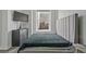 Modern bedroom with a padded headboard and a large window with city views at 57 Forsyth Nw St # 14B, Atlanta, GA 30303