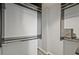 Walk-in closet featuring custom dark-colored shelving units and ample hanging space for clothing and accessories at 57 Forsyth Nw St # 14B, Atlanta, GA 30303