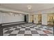 Spacious elevator lobby with patterned floor and marble walls with gold elevators at 57 Forsyth Nw St # 14B, Atlanta, GA 30303