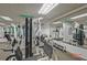 Fully equipped gym featuring weight machines, free weights, and mirrors, designed for a comprehensive workout routine at 57 Forsyth Nw St # 14B, Atlanta, GA 30303