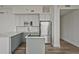 Modern kitchen featuring stainless steel appliances, gray cabinetry, and a center island at 57 Forsyth Nw St # 14B, Atlanta, GA 30303