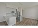 Bright, open kitchen with gray cabinets, an island cooktop, and stainless steel appliances at 57 Forsyth Nw St # 14B, Atlanta, GA 30303