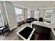 Bright living room featuring an open layout, large windows, and modern kitchen appliances at 57 Forsyth Nw St # 14B, Atlanta, GA 30303