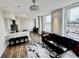 Open living room with a modern kitchen, bar stool seating and a view of the city at 57 Forsyth Nw St # 14B, Atlanta, GA 30303
