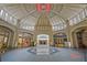 A spacious historic lobby area with detailed ceiling work, a central skylight and tiled flooring at 57 Forsyth Nw St # 14B, Atlanta, GA 30303