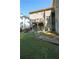 Spacious backyard featuring a stone patio, stairs to a deck, and a charming fountain at 1010 Forest Overlook Sw Dr, Atlanta, GA 30331
