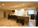 Finished basement features a stone bar with seating, built in appliances, and marble tile flooring at 1010 Forest Overlook Sw Dr, Atlanta, GA 30331