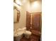 Cozy bathroom features marble tiles, a shower, a toilet, and a vanity with a sink at 1010 Forest Overlook Sw Dr, Atlanta, GA 30331