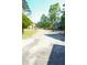 Long driveway leads to a house with serene landscaping, fountain, and partial view of the property at 1010 Forest Overlook Sw Dr, Atlanta, GA 30331
