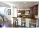 Kitchen with bar top, dark wood cabinets and stainless steel appliances at 1010 Forest Overlook Sw Dr, Atlanta, GA 30331