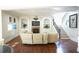 Bright living room features a fireplace, built-in bookshelves, and hardwood floors at 1010 Forest Overlook Sw Dr, Atlanta, GA 30331