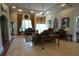 Elegant living room with a coffered ceiling, decorative furnishings, and lots of natural light at 1010 Forest Overlook Sw Dr, Atlanta, GA 30331