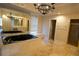 Luxurious main bathroom features a jacuzzi tub, walk-in shower, and ample natural light at 1010 Forest Overlook Sw Dr, Atlanta, GA 30331