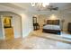 Spacious main bedroom with a raised platform and ensuite bathroom entrance, perfect for relaxation at 1010 Forest Overlook Sw Dr, Atlanta, GA 30331