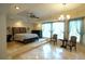 Expansive main bedroom boasts a raised platform, tray ceiling, and lots of natural light at 1010 Forest Overlook Sw Dr, Atlanta, GA 30331