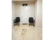 Cozy sitting area with chairs outside a theater room entrance, perfect for pre-movie relaxation at 1010 Forest Overlook Sw Dr, Atlanta, GA 30331