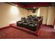 Spacious home theater room with tiered seating and quality projector for a cinematic experience at 1010 Forest Overlook Sw Dr, Atlanta, GA 30331
