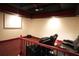 Home theater room features tiered seating and large screen for immersive entertainment at 1010 Forest Overlook Sw Dr, Atlanta, GA 30331