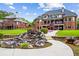 Manicured backyard featuring a cascading water feature and a spacious lawn at 179 Worthington Way, Jonesboro, GA 30236