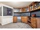 Bar area with custom cabinetry, beverage cooler, and stylish decor for entertaining guests at 179 Worthington Way, Jonesboro, GA 30236