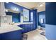 Well-lit blue bathroom with a vanity, white countertop, and tile flooring, perfect for a refreshing experience at 179 Worthington Way, Jonesboro, GA 30236