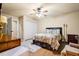 Inviting bedroom with a bed, carpet flooring, a ceiling fan, and a window with plenty of natural light at 179 Worthington Way, Jonesboro, GA 30236