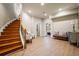 Hallway with wooden staircase, wood-look flooring, and access to other rooms at 179 Worthington Way, Jonesboro, GA 30236