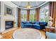 Bright sitting area with large windows, a fireplace, and stylish furnishings for a cozy retreat at 179 Worthington Way, Jonesboro, GA 30236