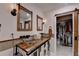 Bathroom features barn door, vessel sinks, rustic vanity, and mirrors, offering a spa-like feel at 248 Riverview Trl, Roswell, GA 30075