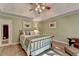Charming bedroom with tray ceilings, soft green walls, and cozy decor, perfect for relaxation at 248 Riverview Trl, Roswell, GA 30075